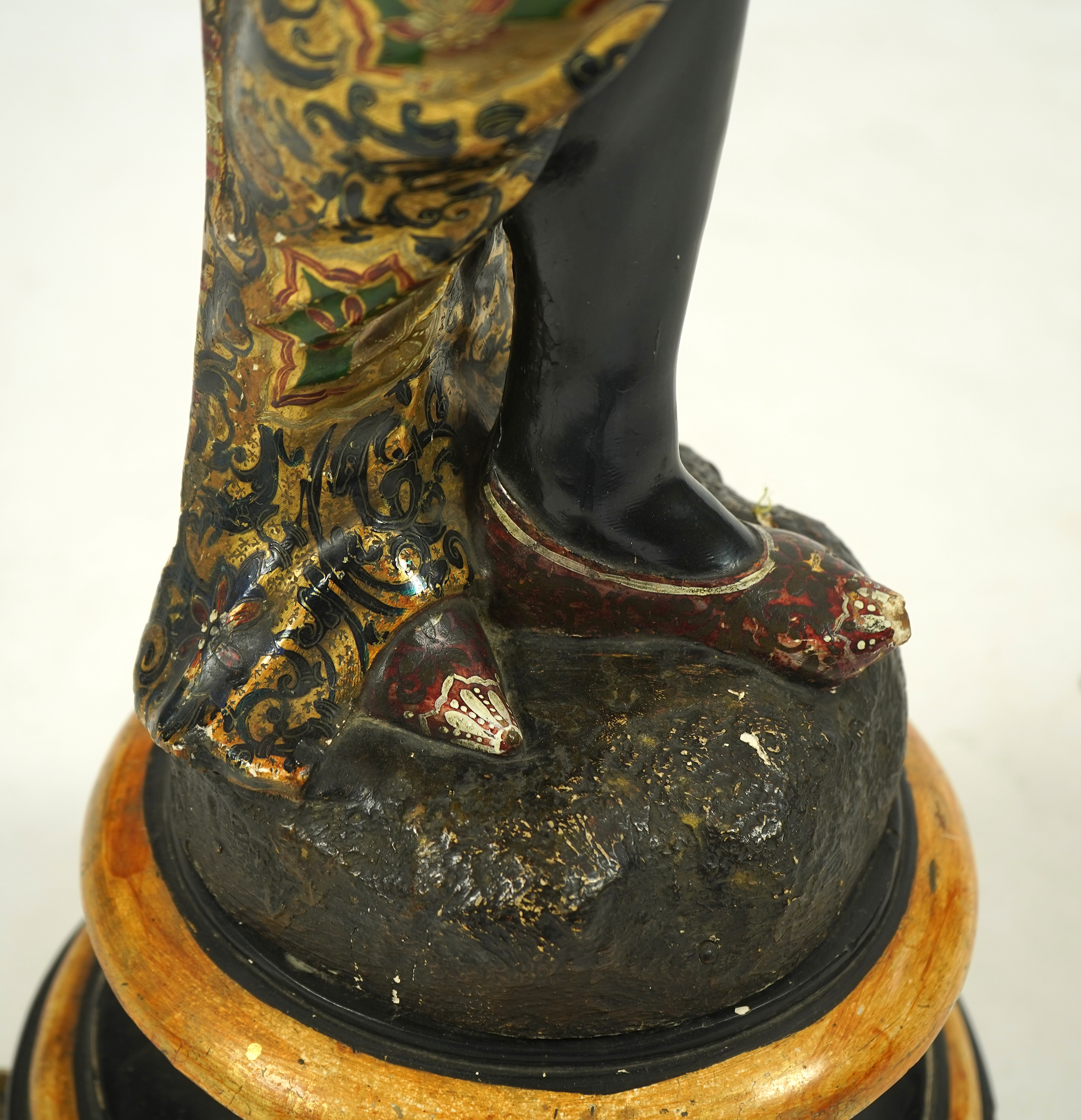 A 19th century Italian carved wood and composition polychrome painted blackamoor torchere